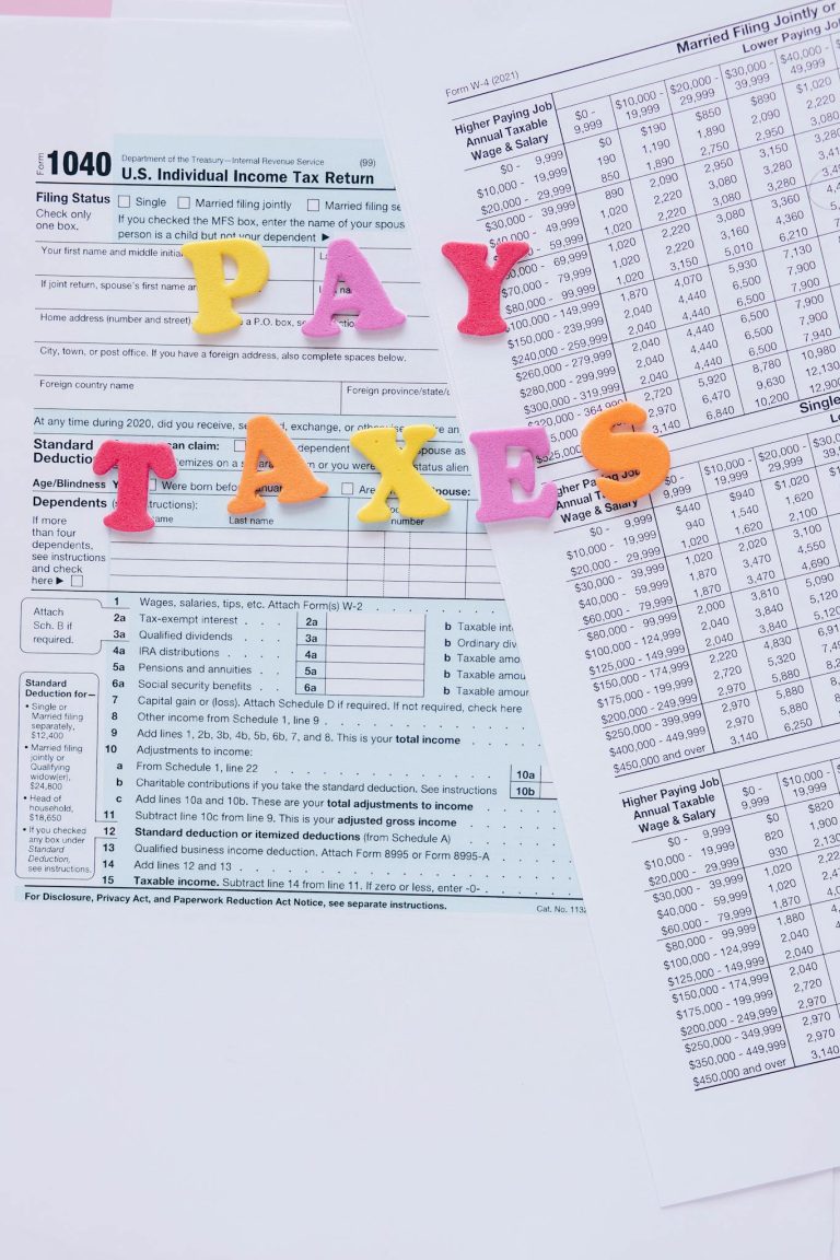 Colorful letters on tax forms, ideal for finance and tax-related themes.